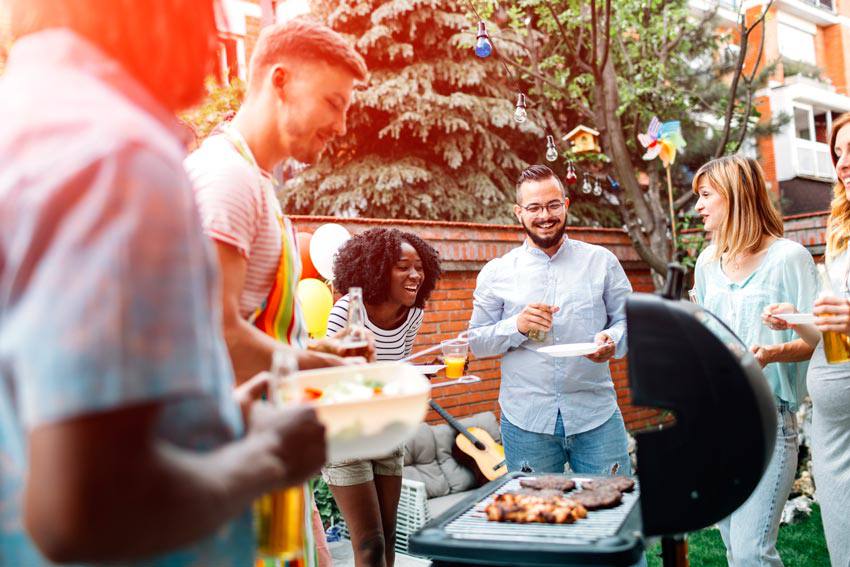 A group of people enjoying a barbecue party
