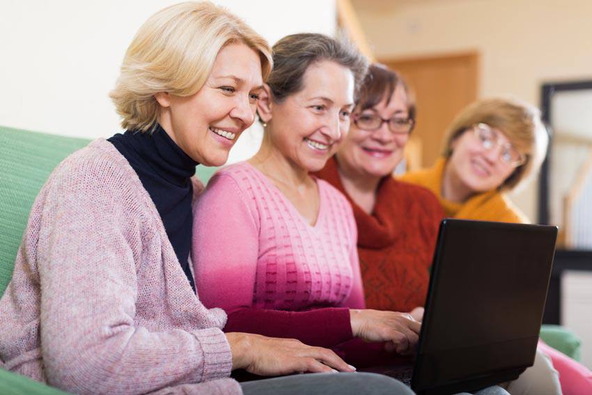 Elderly ladies in front of a computer