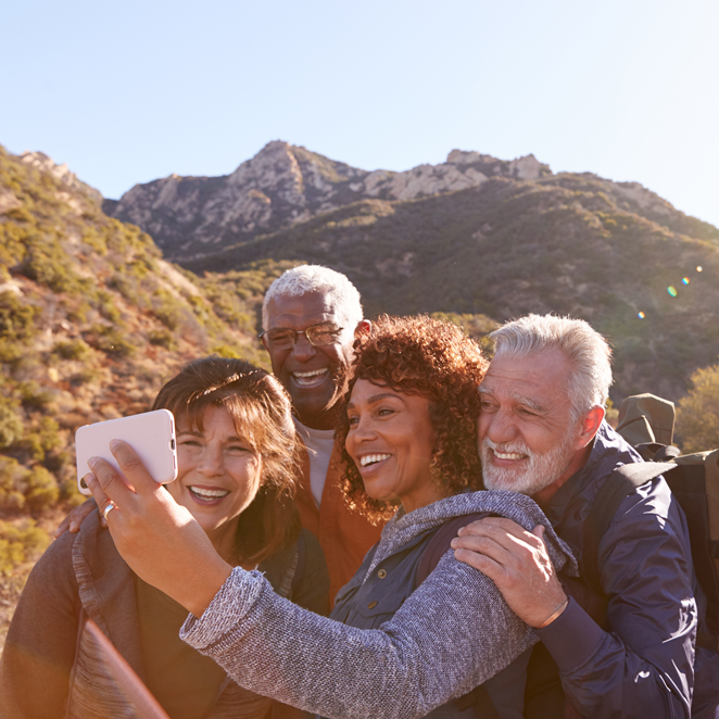 Father and son play next to a lake