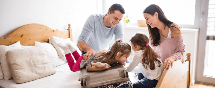 family preparing their travel luggage