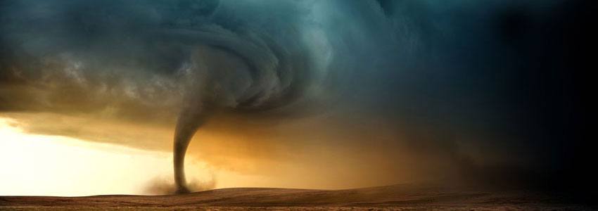 A tornado forming in the middle of the desert