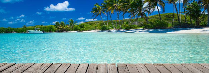 A beautiful beach with light blue water 