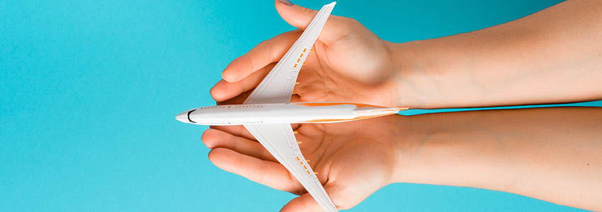 A toy plane in hands