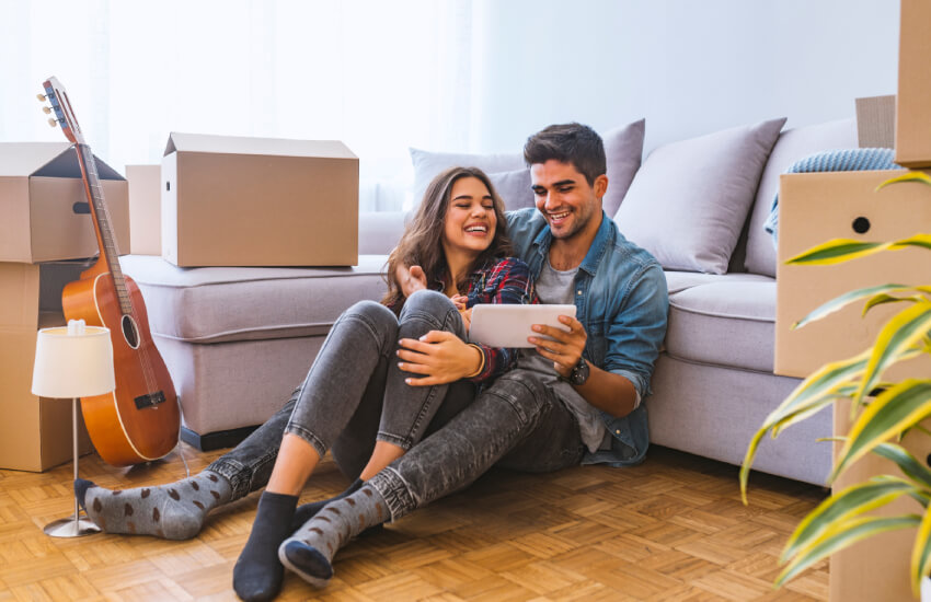 Happy couple discussing design of new apartment