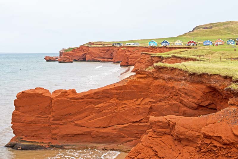The red cliffs and colourful homes of the Magdalen Islands