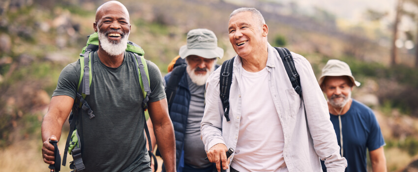 a group of old men hiking on mountain